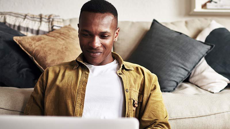 man looking at laptop